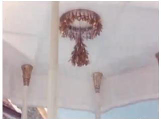 The gold champak would be placed around the shower head of a shower hall for the coronation ceremony